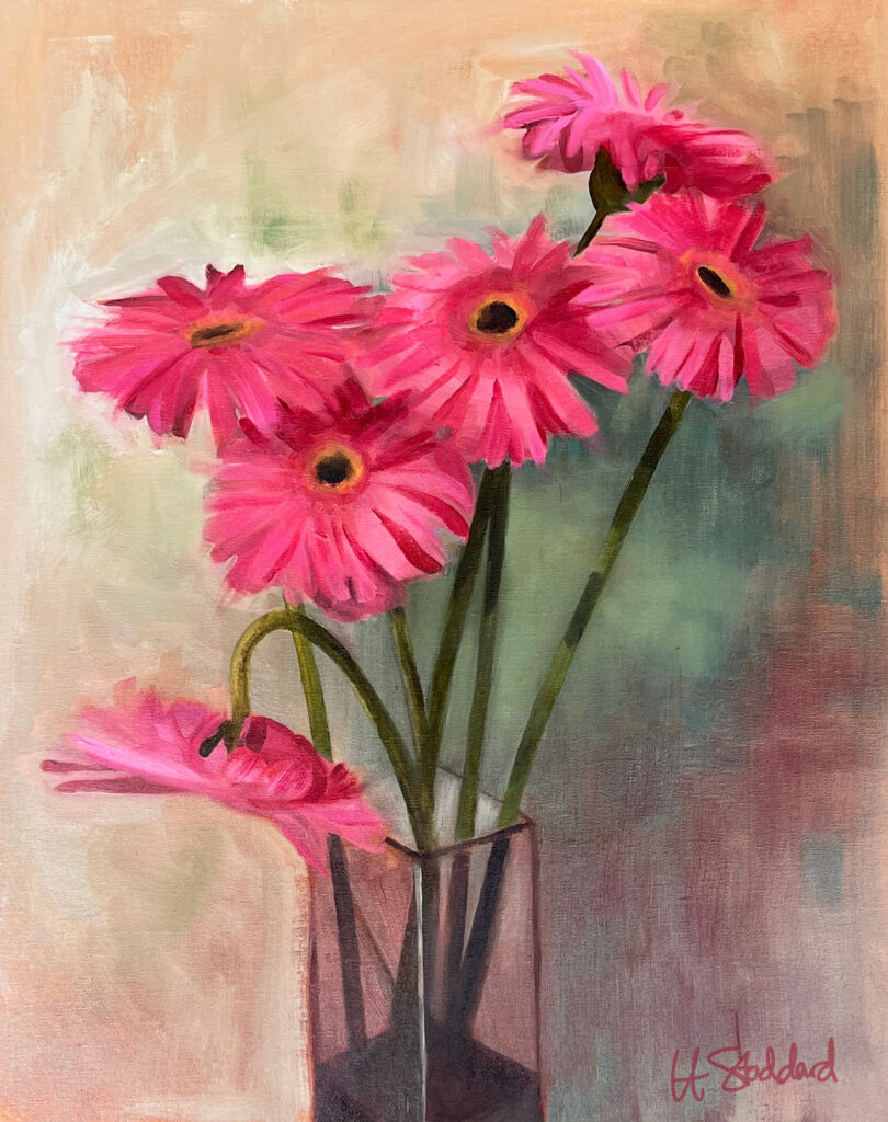 Vase full of pink daisies